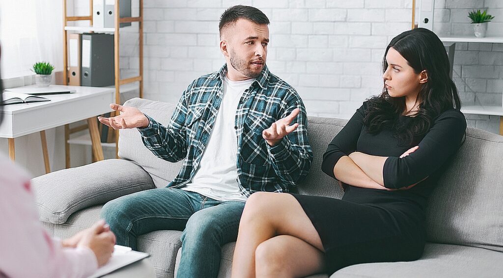 Young European Couple Arguing During Therapy Session